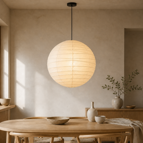 Akari D washi paper lantern pendant with black cord in a warm dining room