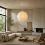 Akari D white cord paper lantern pendant in a high ceiling living room