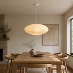 Akari EN 27.5 inch pendant with white cord above a dining table