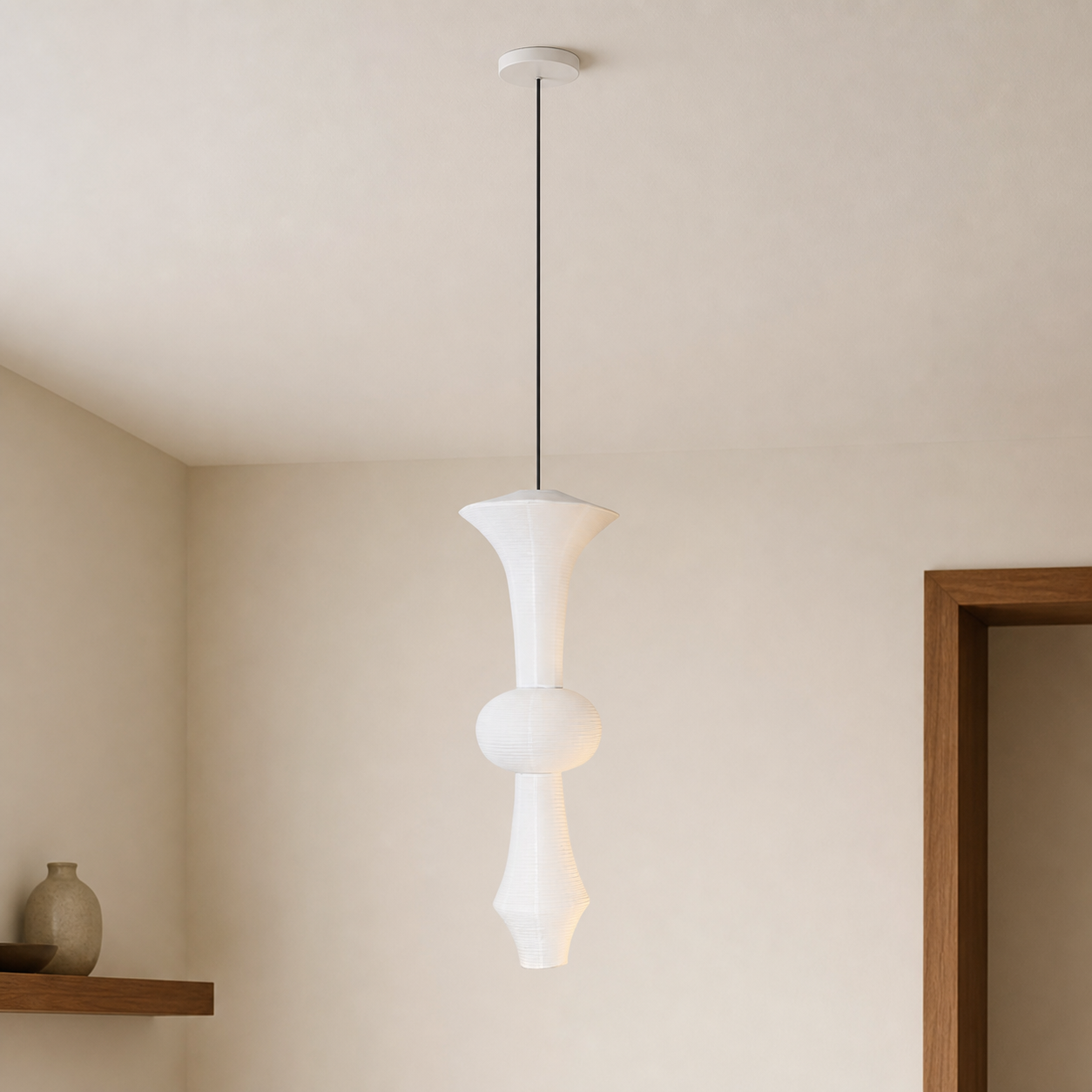 White ceiling canopy and hardwired suspension of the Akari pendant light