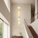 Akari Dia 16.9 by H 86.6 inch pendant light in a walnut-accented stairwell