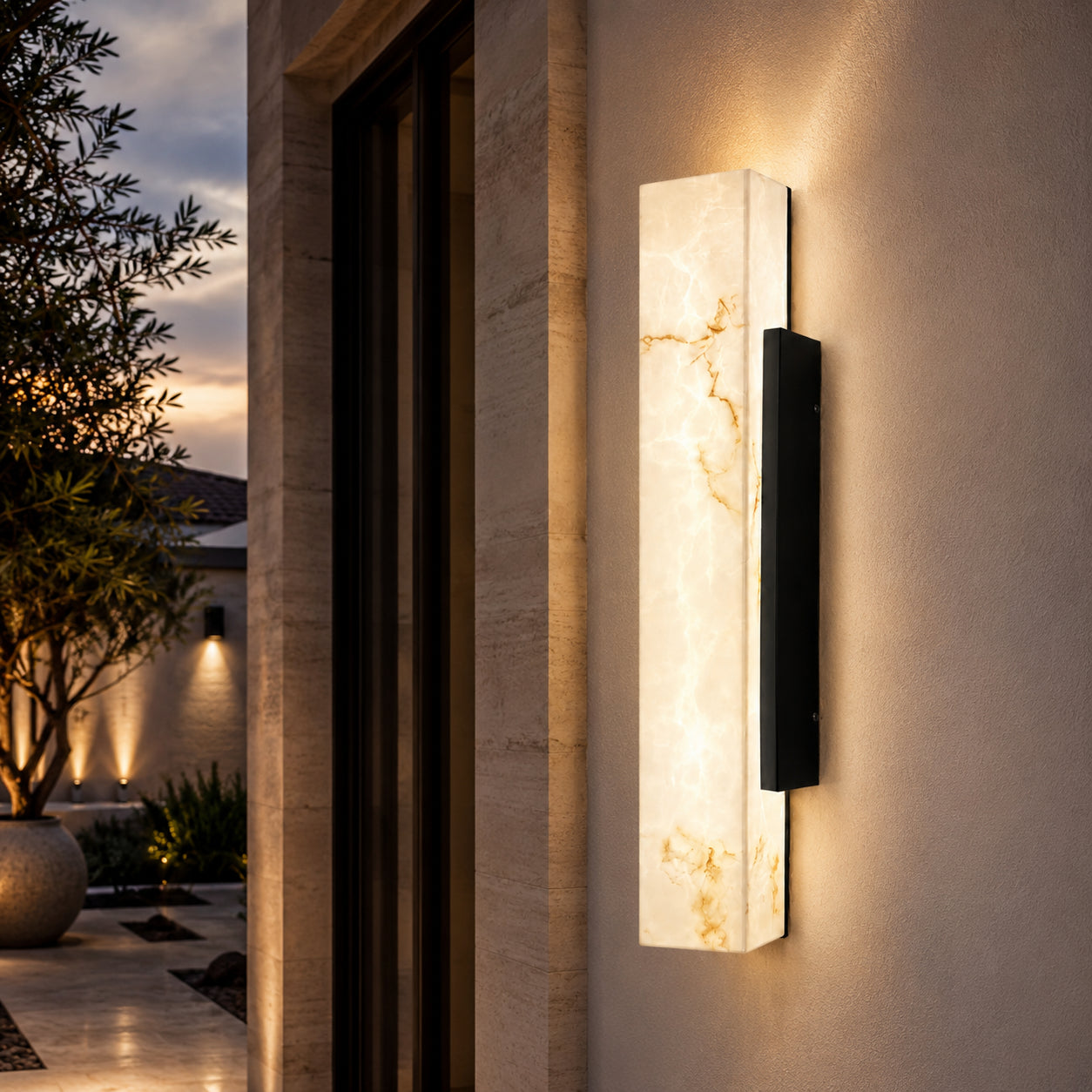 Alura modern exterior wall light with black metal backplate