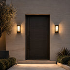 Avrn outdoor wall light mounted beside a modern exterior entry