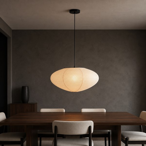 Akari A oval washi paper pendant light with black cord in a warm interior