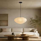 Akari A oval paper pendant light in a relaxed living room