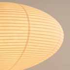 Close view of the Akari A washi paper shade texture and ribbed structure