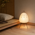 Akari Model A2 Japanese paper lantern floor lamp beside tatami seating